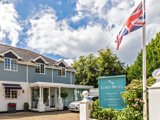 Exterior of the Lord Bute building on Lymington Road, Highcliffe, with signage and Union Flag